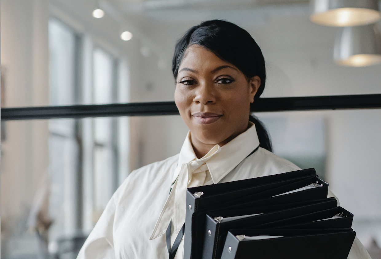 Woman working with binders