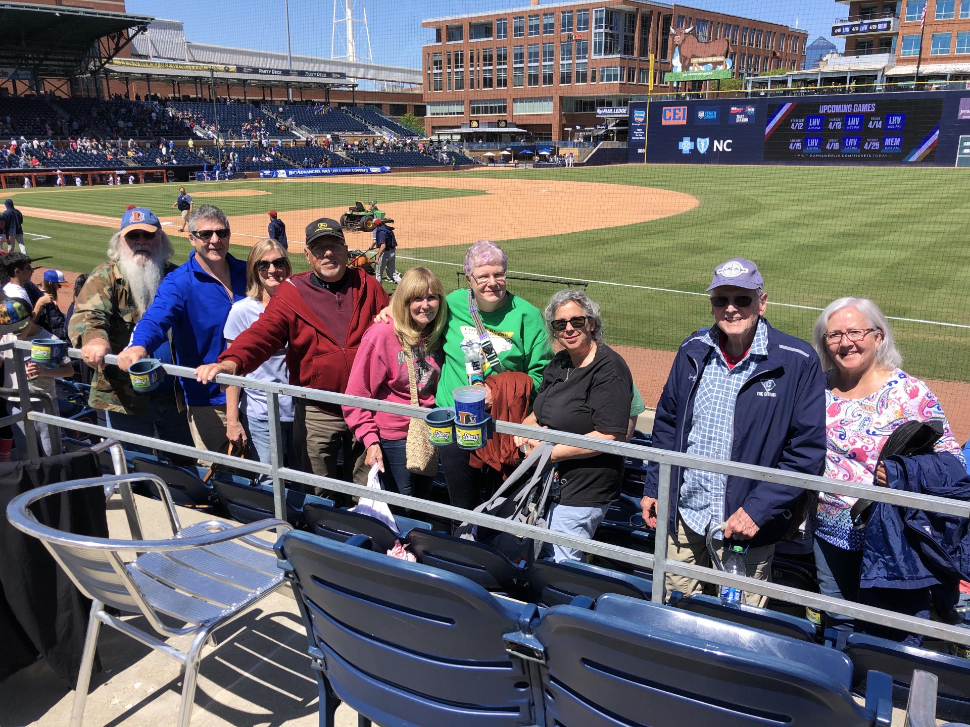 seniors pose for a group photo at a Durham Bulls baseball game